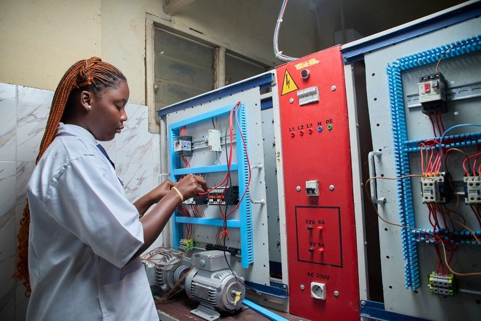 Technician servicing an inverter on site