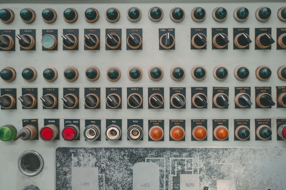 Close-up of an industrial control panel with push buttons